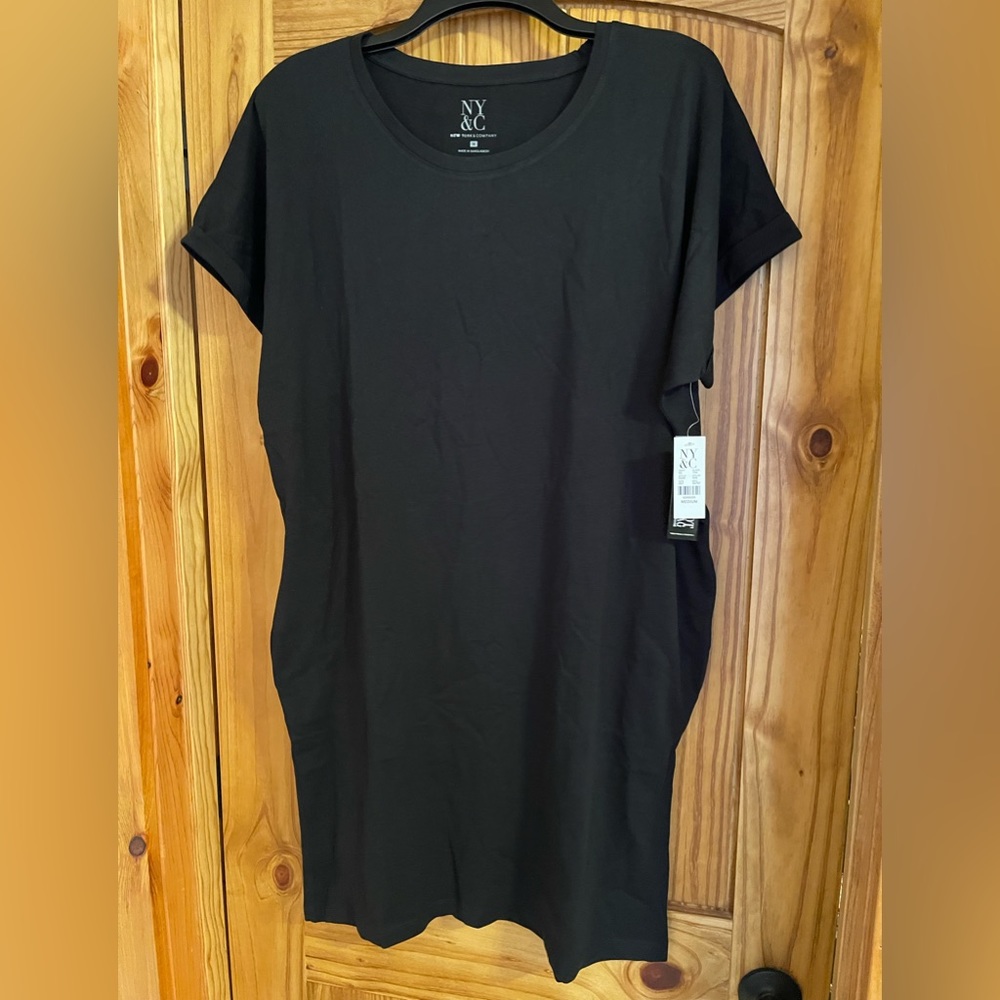 NWT black T-shirt dress with pockets from New York & Company. Size medium.